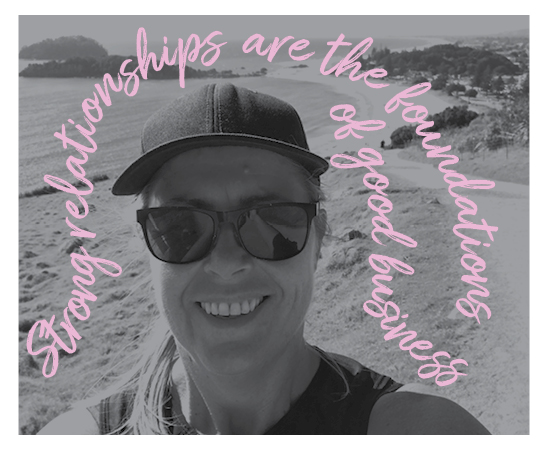 Kathryn Dunn Business Director at Spruik, smiling outside exercising in the sun, with the ocean, beach and mountain in the background. text reads "strong relationships are the foundations of a good business."