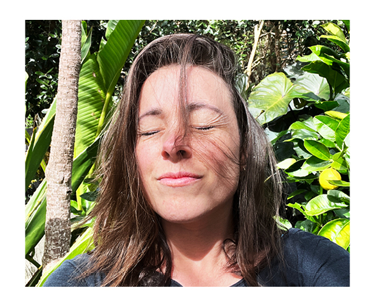 Stacey Morrissey Design Director at Spruik, closing her eyes with the sun on her face and the trees in the background. text reads "The art + science of creative + connections."